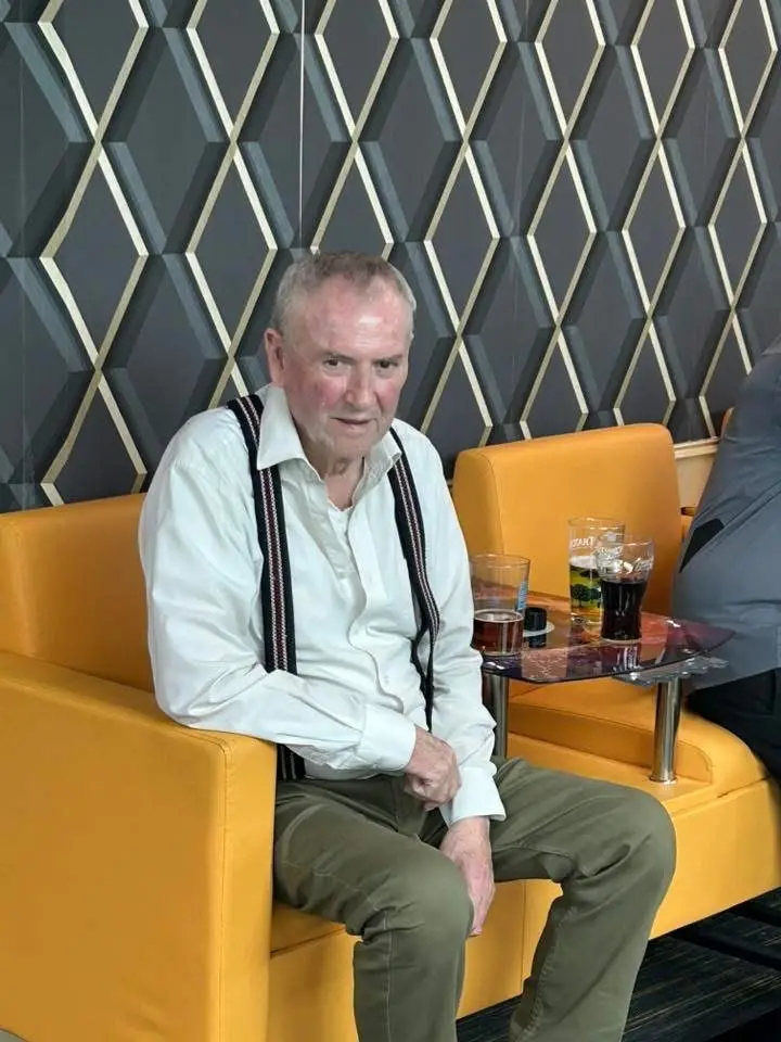 A member sitting in one of the club's armchairs between matches